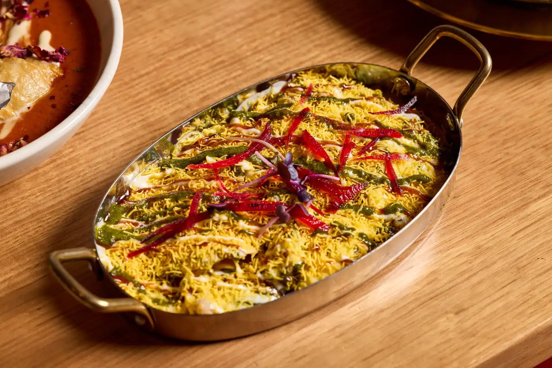 Colourful Indian dish in metal tray