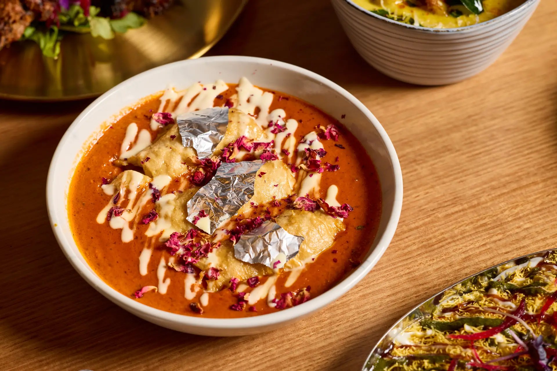 Rich curry with decorative toppings