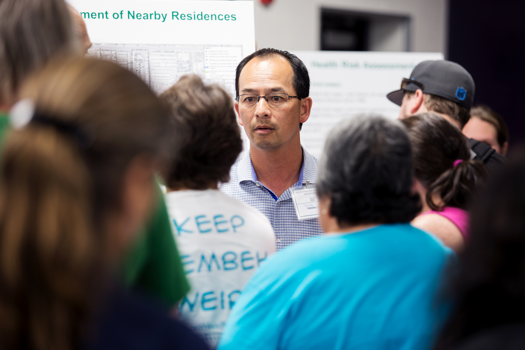 Truong Mai, a partner at Ametek environmental consultant ERM, staffs the air testing table at a community meeting on the underground contamination in El Cajon. June 4, 2017. Megan Wood/inewsource