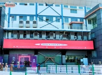 Large outdoor LED video wall mounted on building exterior, showing a bright, high-resolution digital display visible from the street.