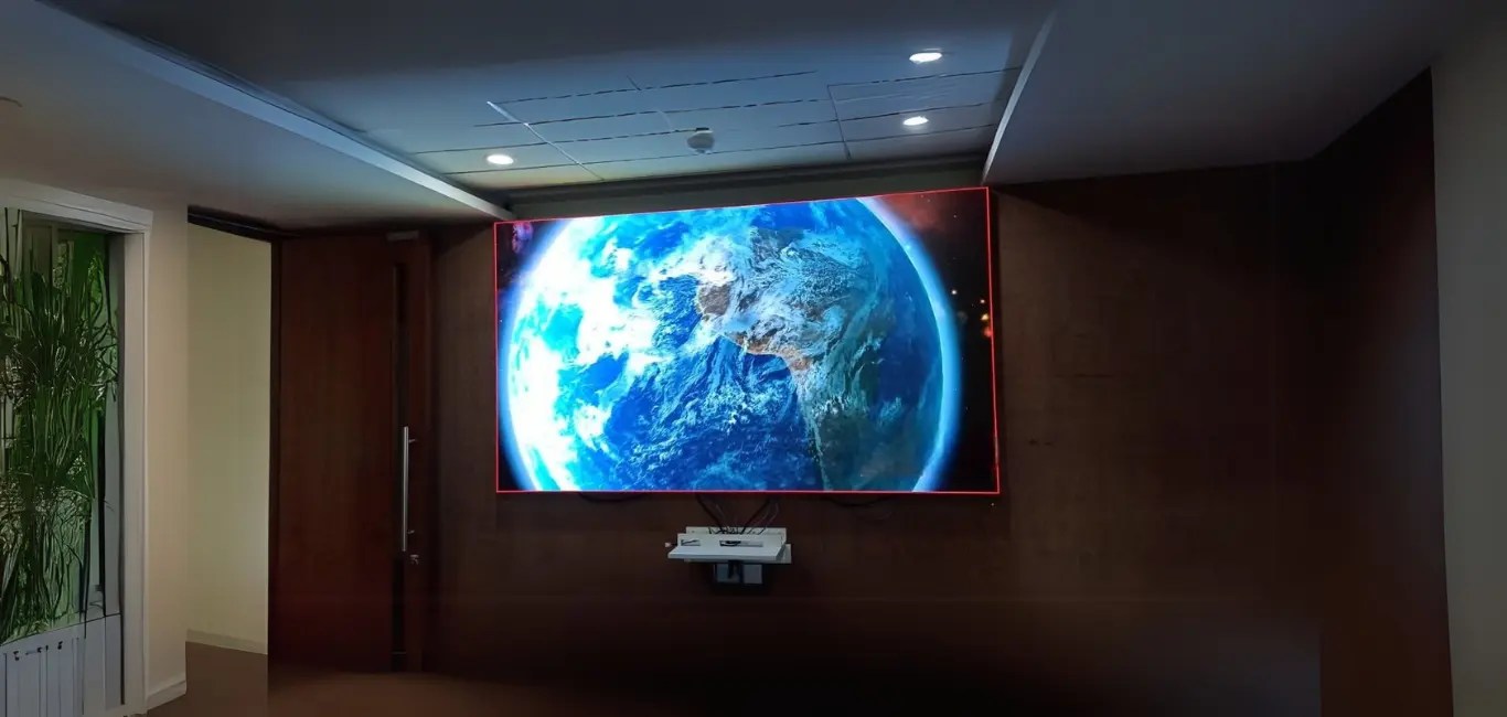 Office LED display screen featuring Earth satellite view in modern corporate interior