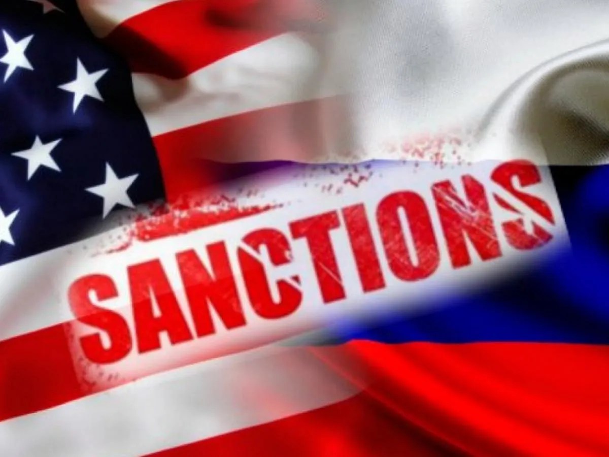 Sanctions U.S. and Russian flags with the word sanctions highlighting economic and political pressure