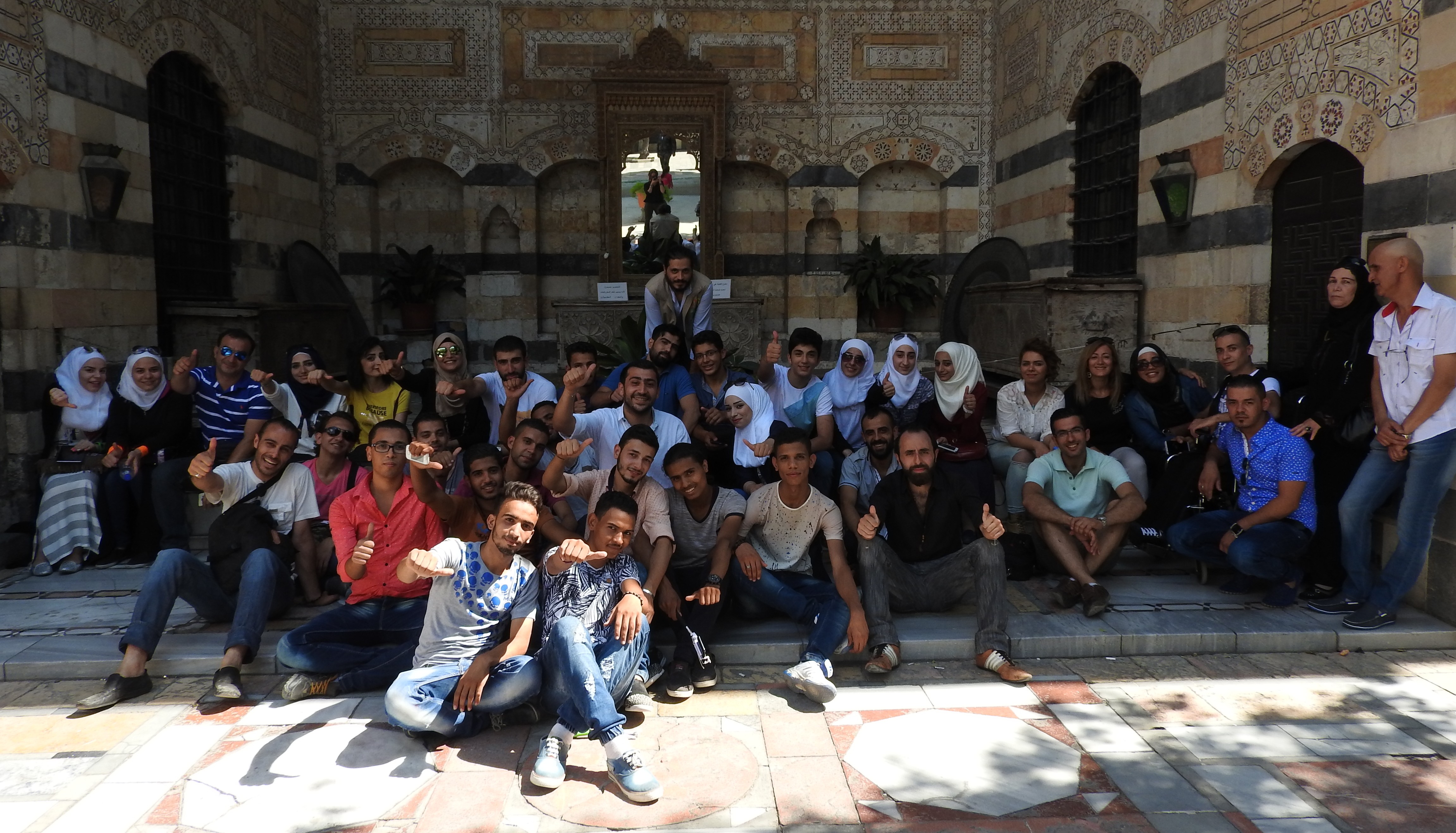 Volunteers from the Saaed Association relax after the second day of ‘Eid activities for children. Instead of clothes or money, “we gave children hope and joy,” one volunteer said. In contrast to the sectarianism imposed on Syria by Gulf States and Turkey, Syrians maintain their unity and secularism, emphasized by such volunteers whose allegiance is to humanitarism and helping the less fortunate. See: https://ingaza.wordpress.com/2016/07/27/volunteerism-in-syriaa-journalists-journey-to-the-heart-of-syria/