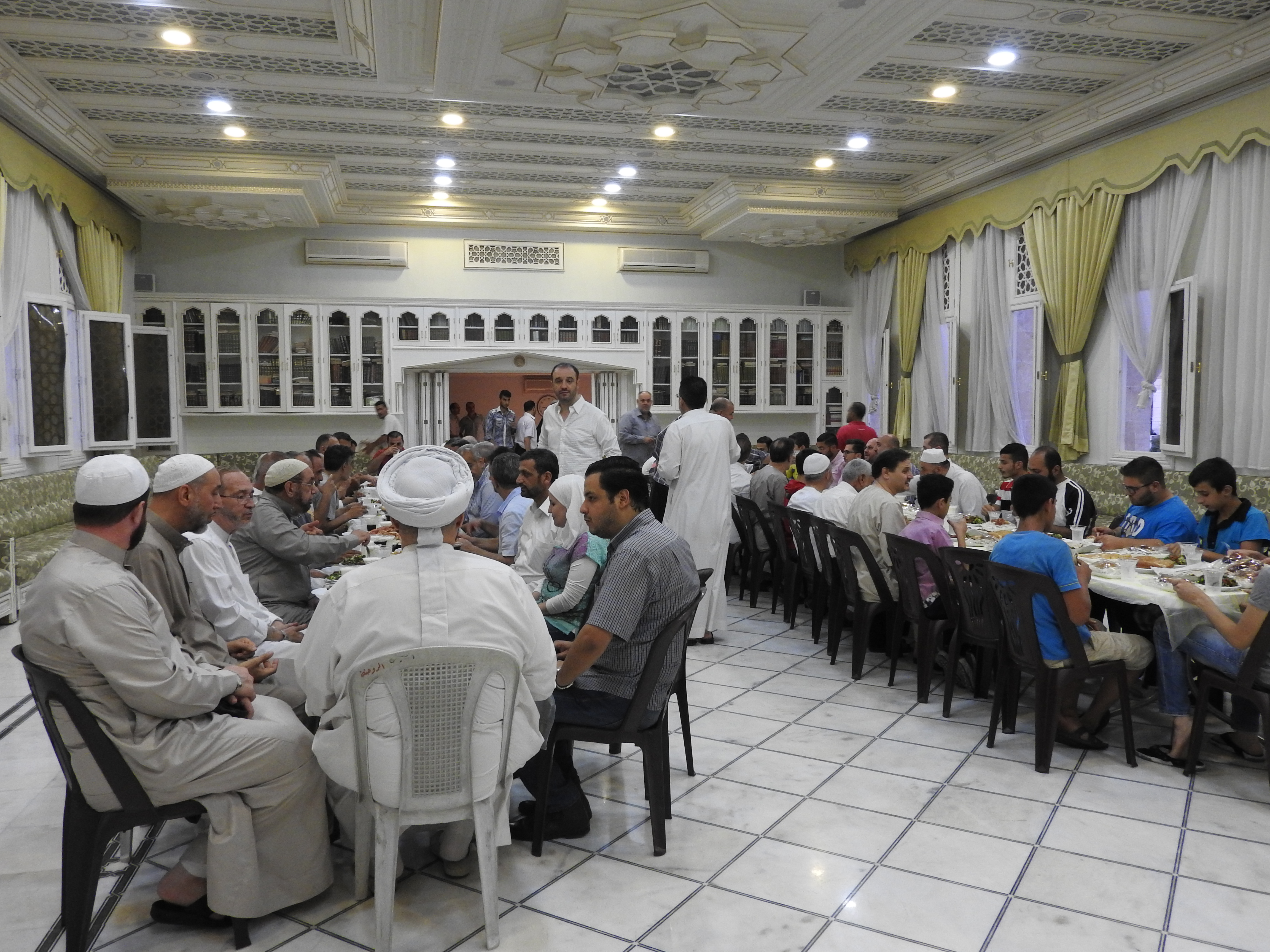 Invited by Mufti Hassoun to iftaar meal in Rowda mosque, Aleppo, July 2016. A female in such a setting would be unthinkable in Saudi Arabia, which supports terrorism in Syria.