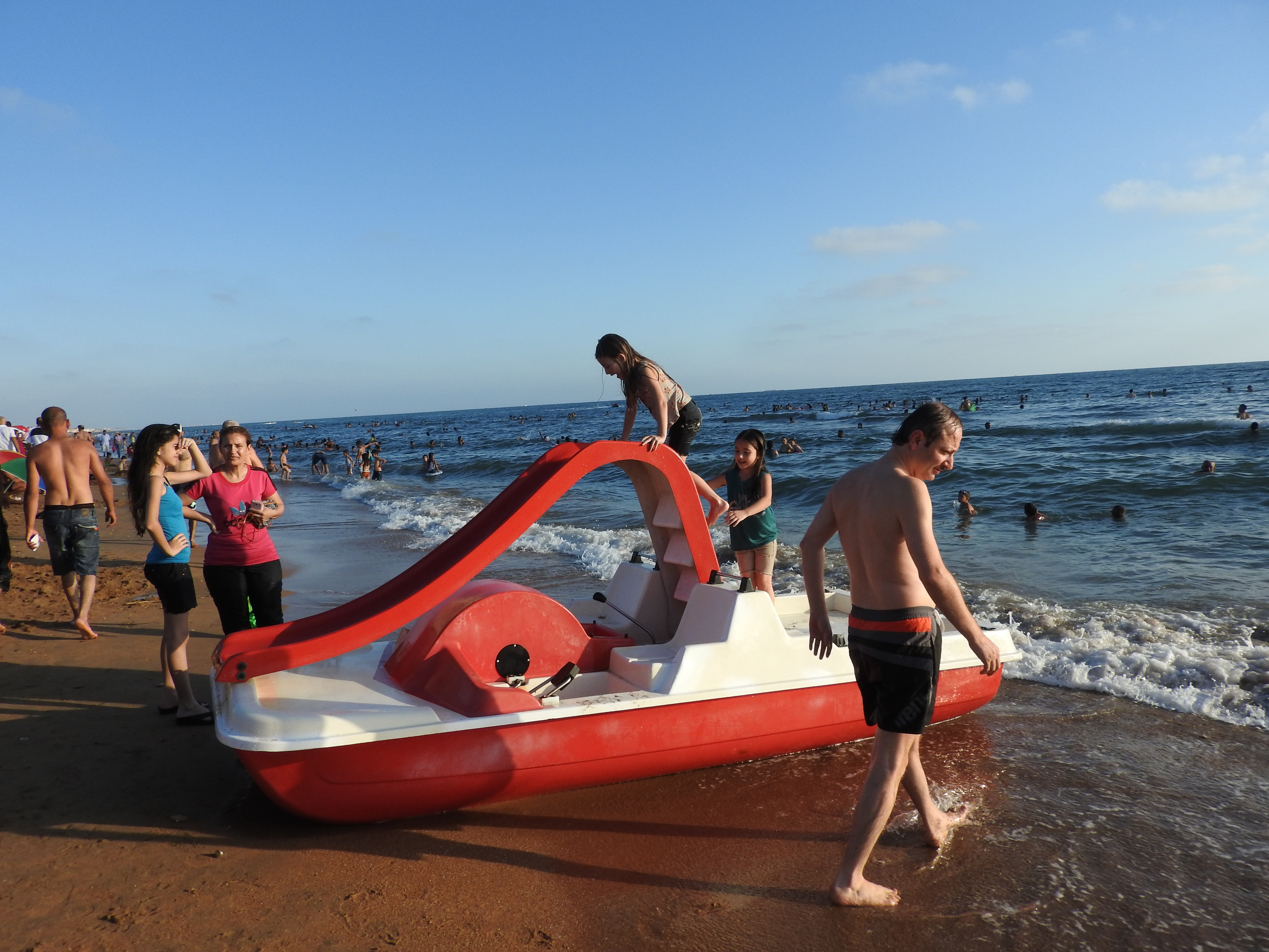 In 2016, I visited Tartous, to see the transportation terminal which was attacked by Western-backed terrorists on May 23rd, the same morning a transport hub (and street and hospital) in Jableh (which I also visited) was attacked. Tartous houses 1 million internally-displaced from all over Syria, including people from Deir ez-Zor, Raqqa, Aleppo, Homs, and elsewhere, according to the Governor of Aleppo (as of mid-2016), who said the city is known as "mini-Syria" in recent years due to its hosting of Syrians from all over. "The 1 million IDPs share Tartous' resources, schools, and hospitals with 1 million inhabitants." They are not housed in tents and camps, but in schools/other buildings-turned refugee centres, as well as houses. I visited one of these centres while in Tartous, also visiting centres in Latakia, Aleppo, Damascus over the past few years. While in Tartous I saw an endless sea of posters of martyred soldiers, billboards listing their names, to give respect to their defense of Syria. I was also treated with an unplanned visit to the sea, where I saw normal beach scenes, and more: Syrians of varying ages and faiths, living, loving, resisting the war of terror on their country. While there, my host made sure to note: "Do not think these people haven't suffered.There isn't a house here that hasn't lost a family member or relative," she said of Syria's fight against terrorism and for the restoration of peace and security. Videos here: https://www.facebook.com/EvaBoBeeva/posts/1611030225573632