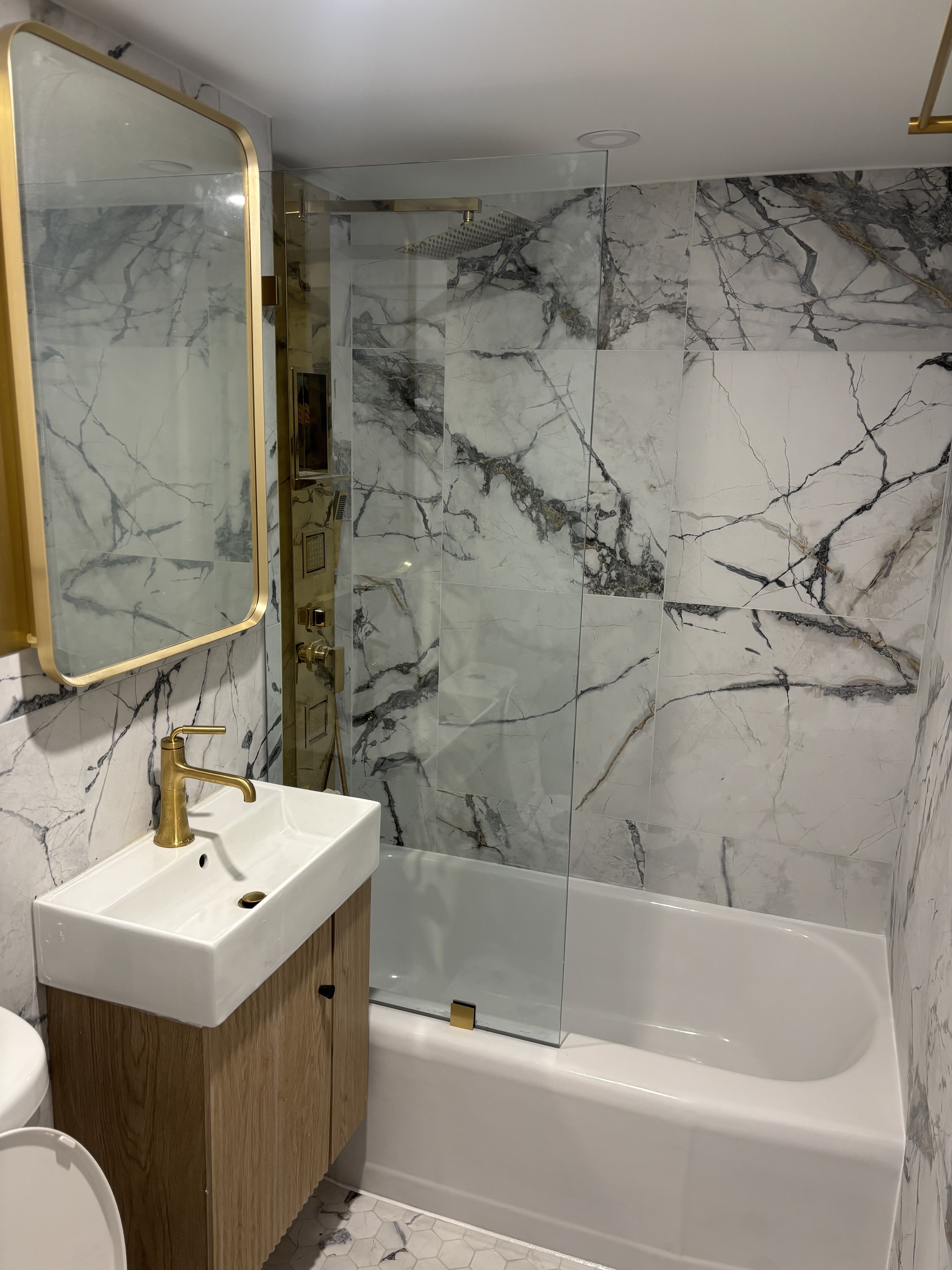 Floor tile installation in NYC residential home with natural stone tiles