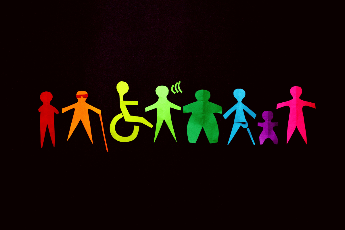 A black background with paper cut out people with different disabilities. Each is a different colour and they make up the colours of the rainbow together.