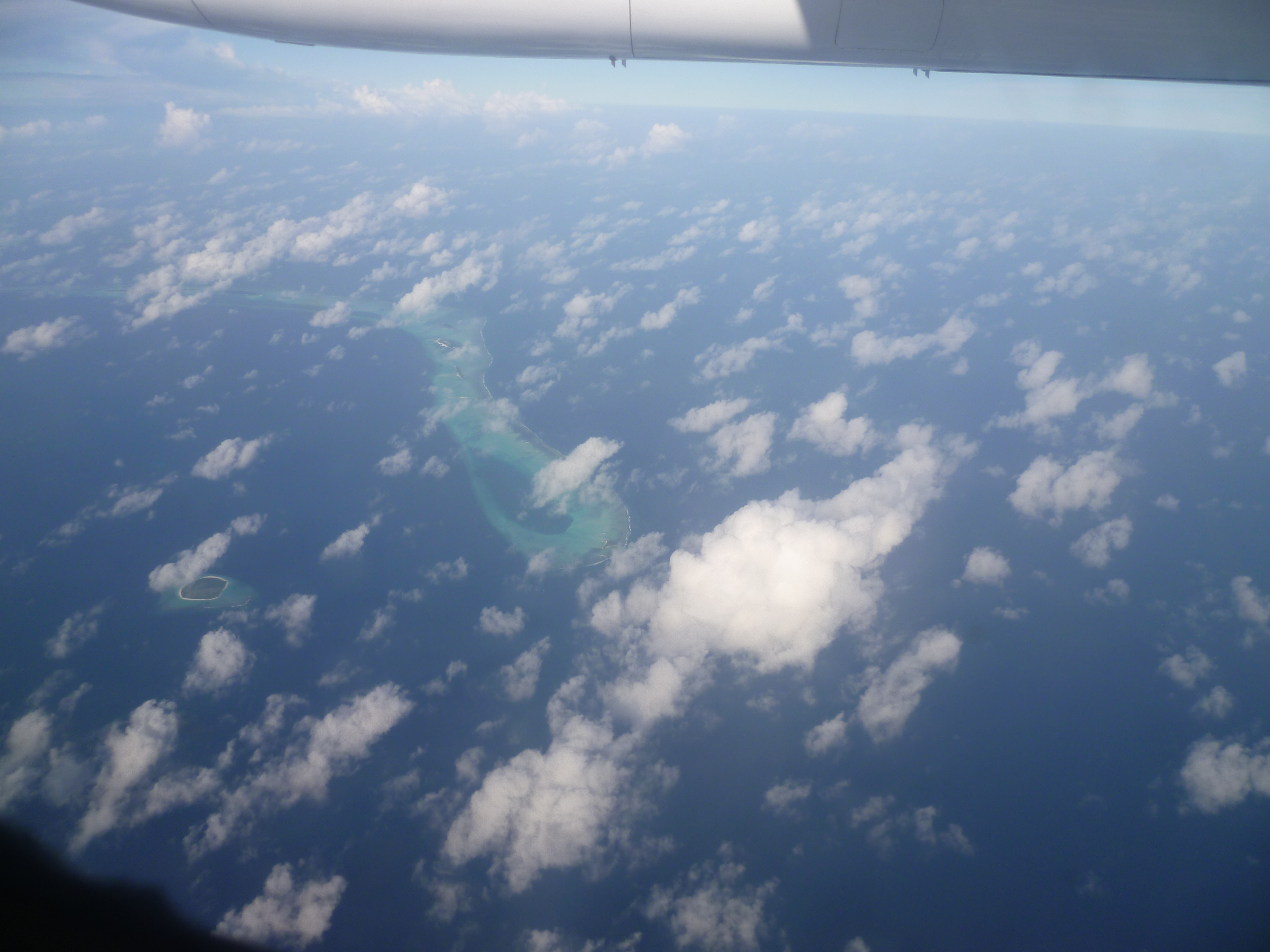 The Aerial View of Maldives, seen as tiny islands scattered across the Indian Ocean