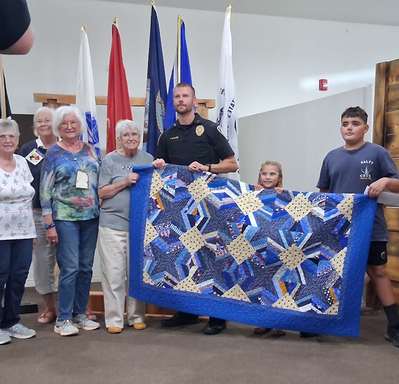 First responder's family and 2 of the quilt makers