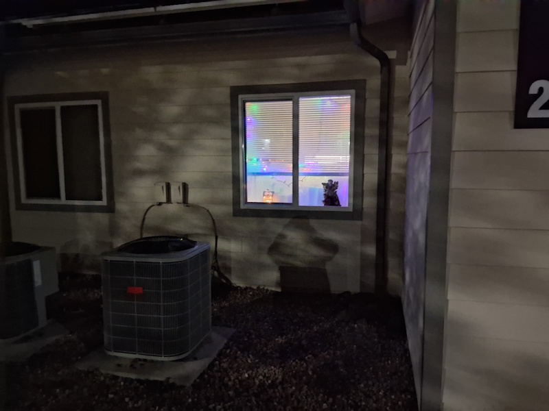 LIGHTS INSIDE KITCHEN WITH AN ANGEL AND TINY LIGHTED HOUSE