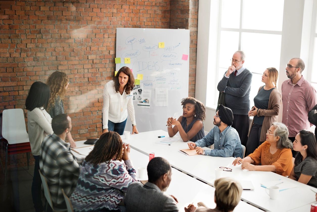 Diverse business team brainstorming around table