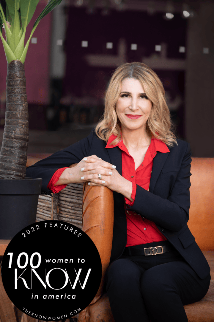 Smiling professional woman in red blouse