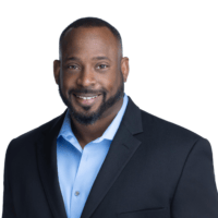 Smiling professional in suit jacket and blue shirt