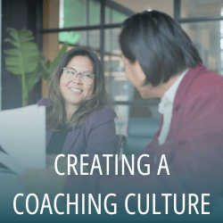 Two colleagues discussing coaching culture