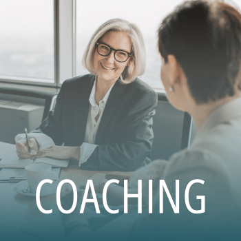 Female coach smiling during business coaching session