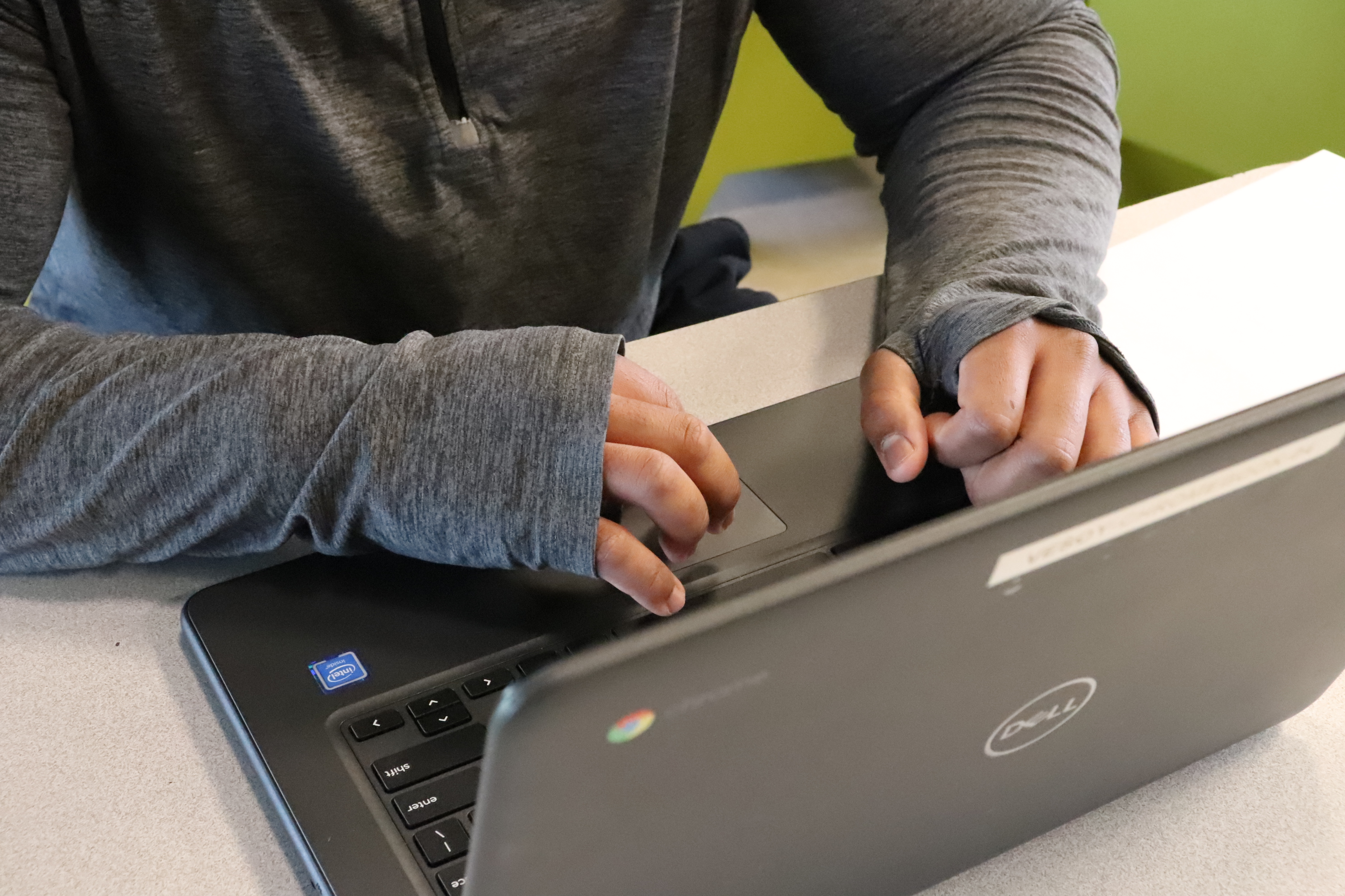 hands working on a laptop