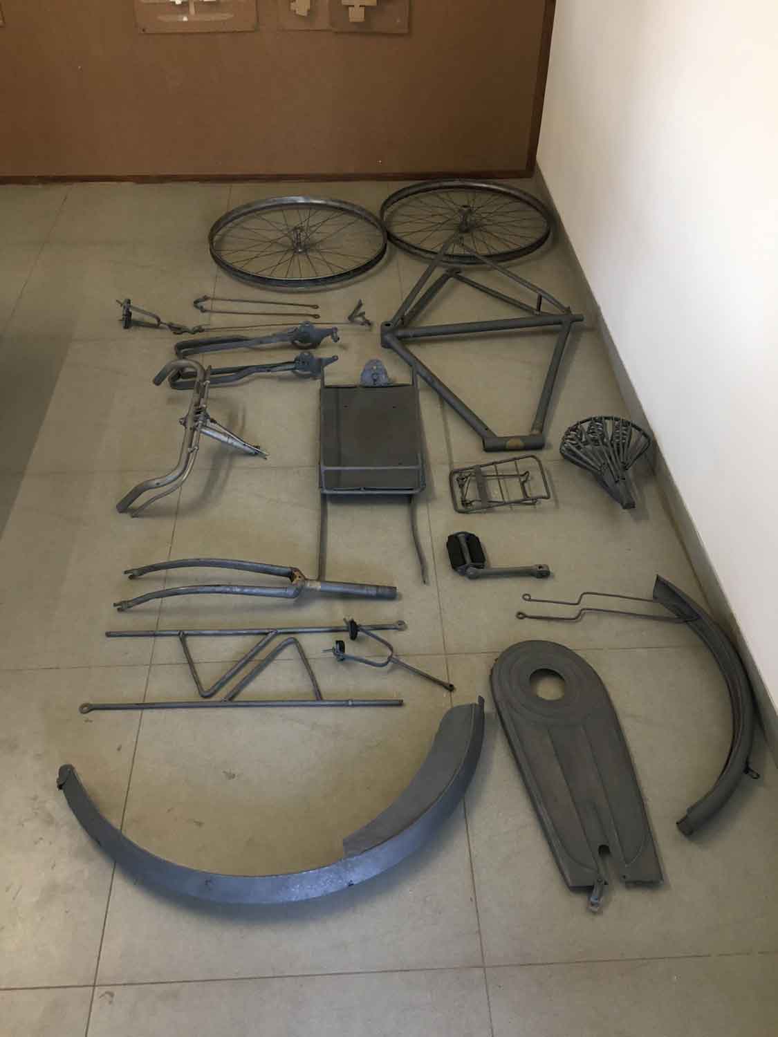 The dismantled cycle laid out post sandblasting