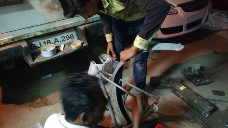 Restoration process of the cycle with Anisbhai and his son at work late into the night