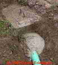 PHOTO of a repair at a septic tank leak at its inlet pipe
