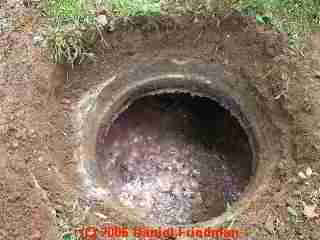 PHOTO of the septic tank opening after the cover has been removed.