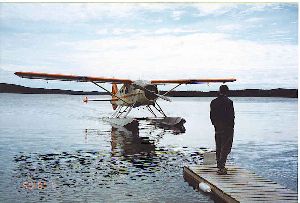 Float plane gliding to our dock