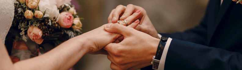 a close-up of a man and woman holding hands