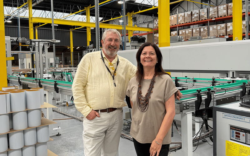 two people in a factory