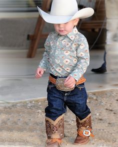 Got me a hat and some cowboy boots pretty young.