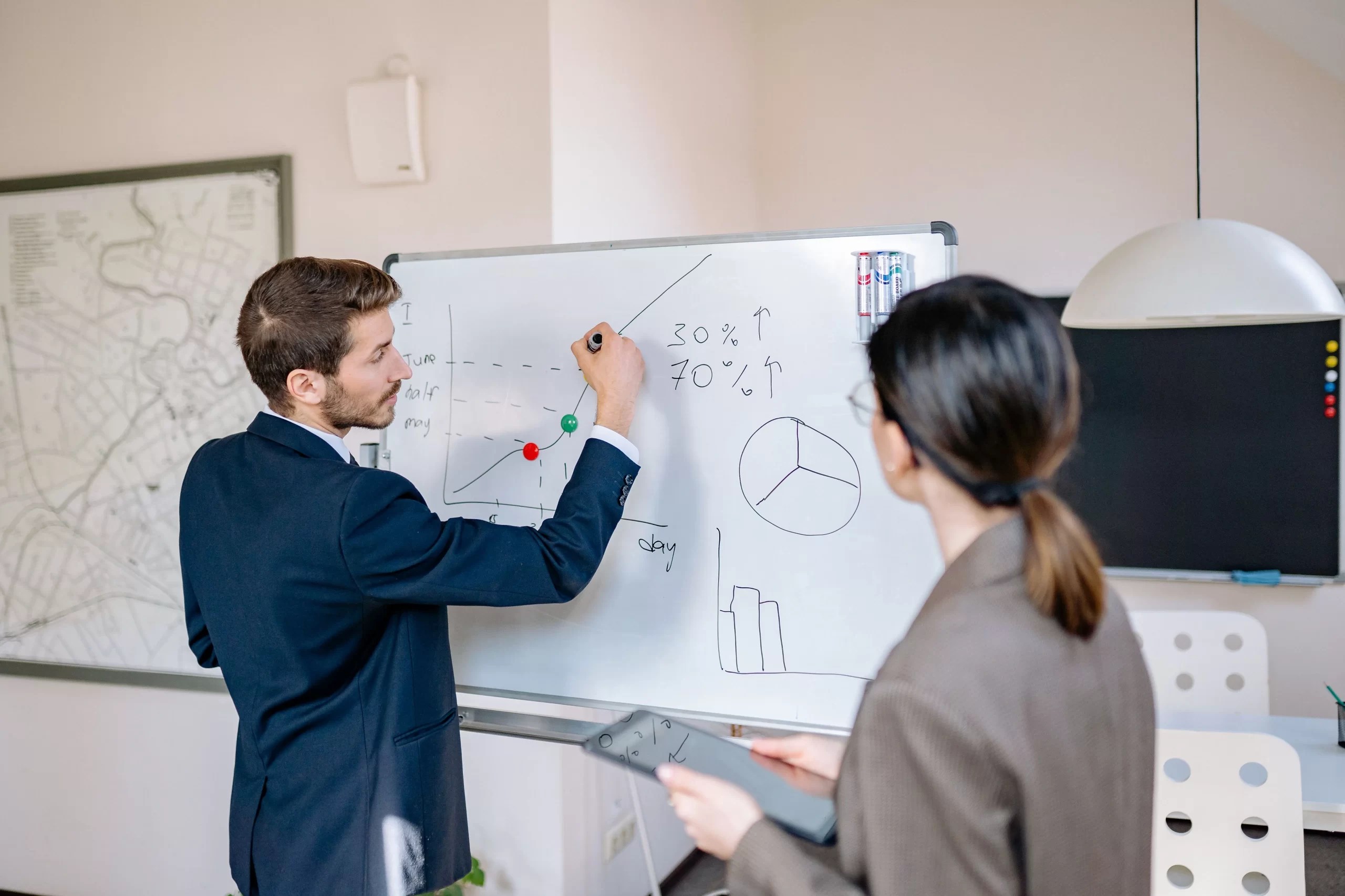 Executives planning an enterprise technology roadmap on a whiteboard