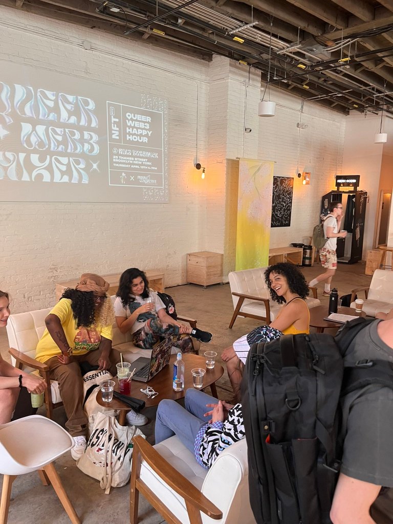 a group of people sitting in couches around a table, enjoying the cafe vibes
