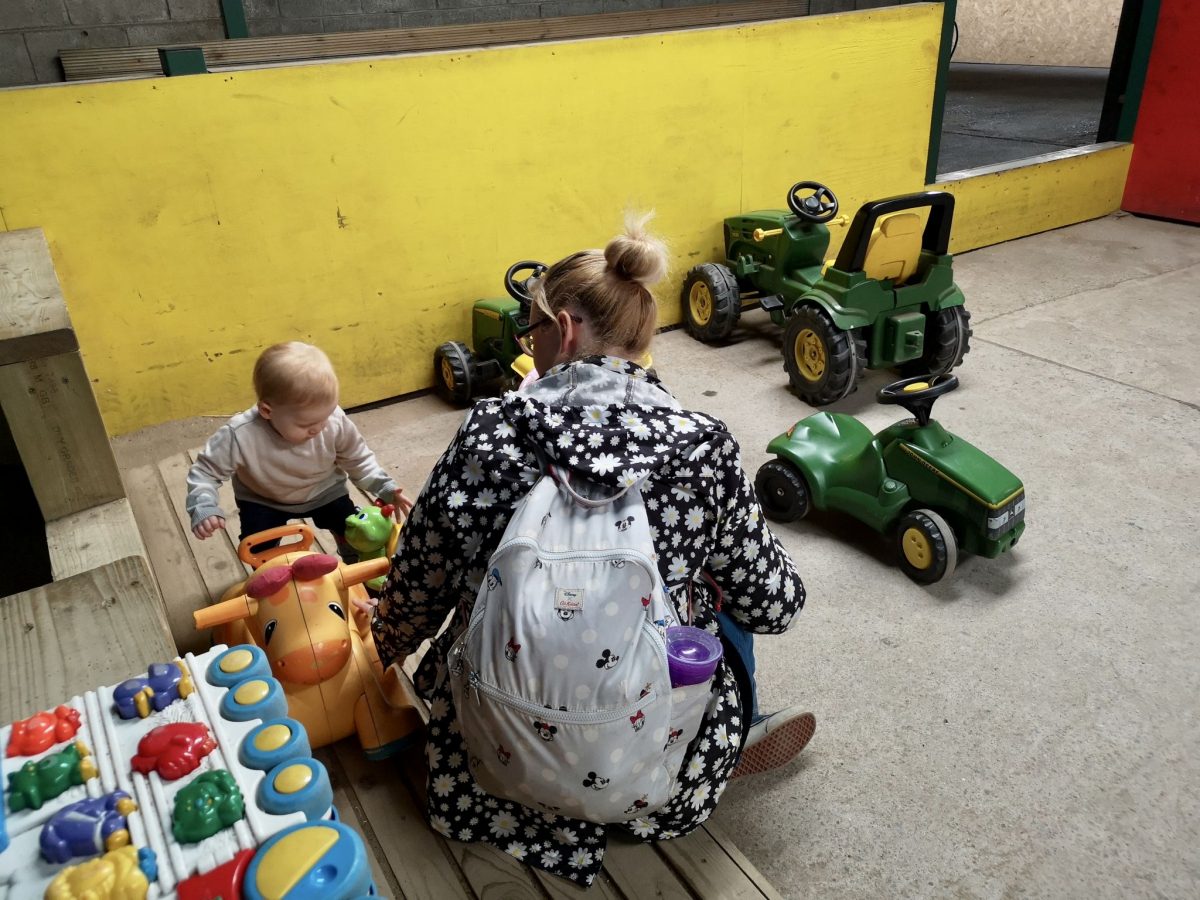The smaller indoor play area with rideable tractors at Walnut Tree Farm Park