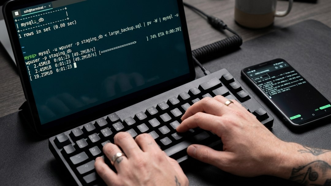 Linux terminal running a MySQL database import command over SSH