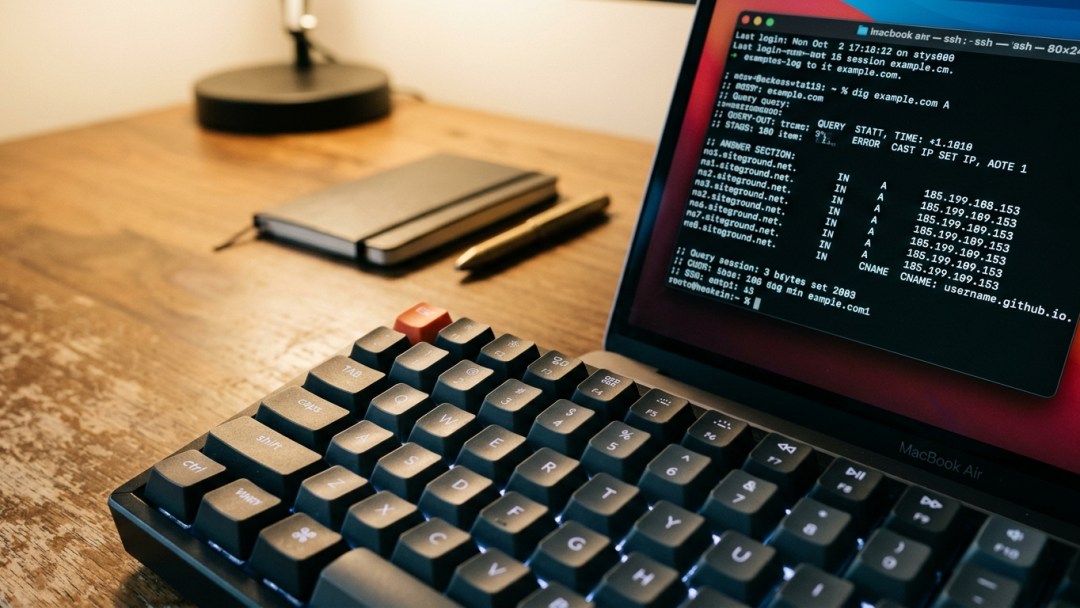 Terminal screen displaying dig DNS queries for GitHub Pages connected through a Namecheap domain