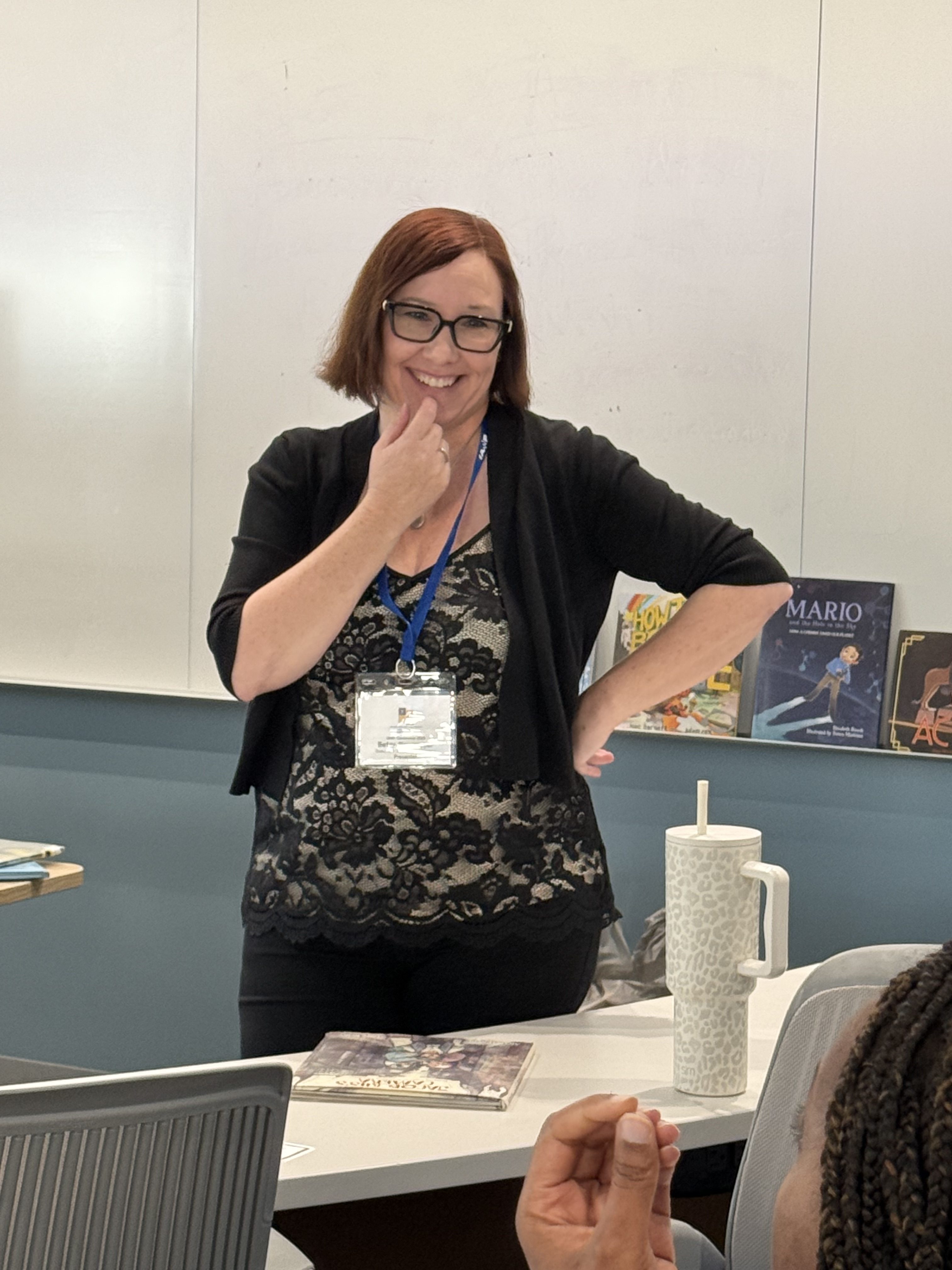 Betsy Newmeyer presenting at a conference for writing teachers.