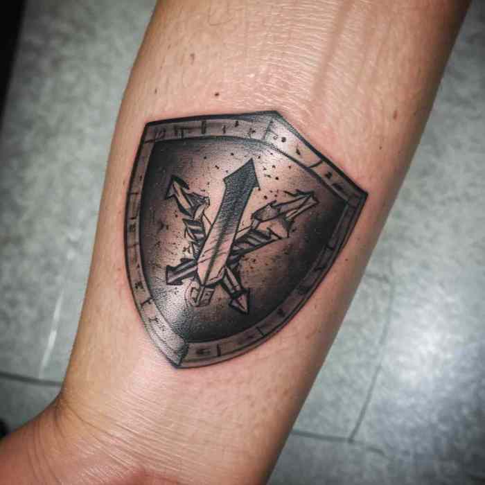 Shield with Arrow Strikes Tattoo