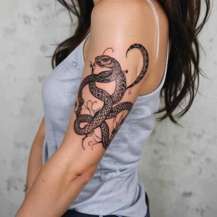 Snake Around the Arm Tattoo