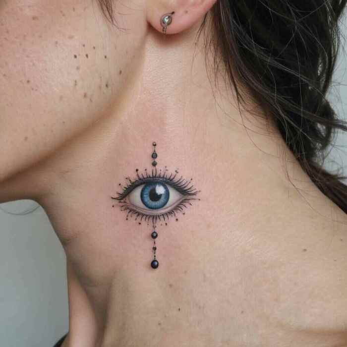 Tiny Evil Eye with Delicate Dot Work Tattoo