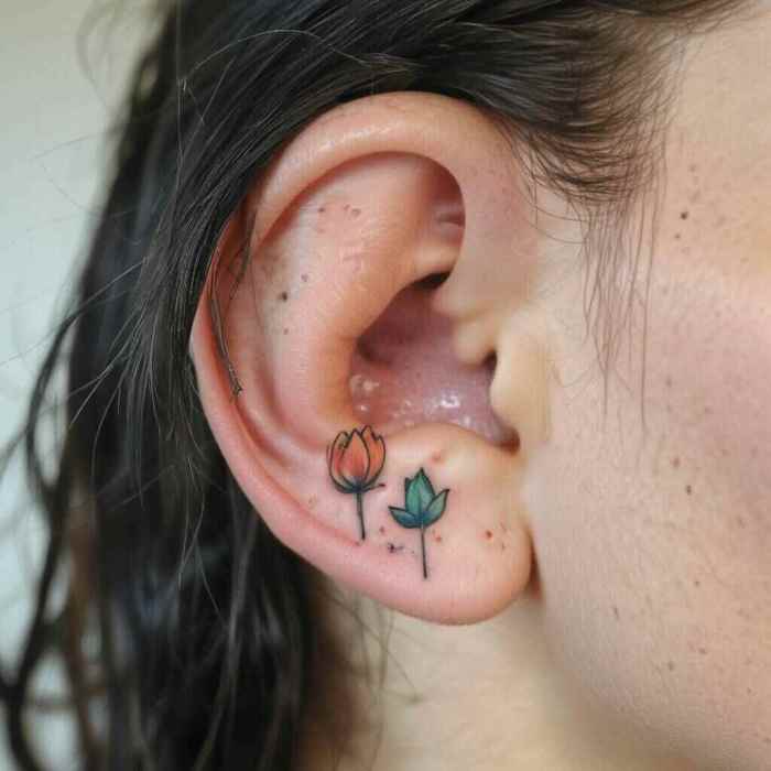 Tiny Tulip Behind the Ear Tattoo