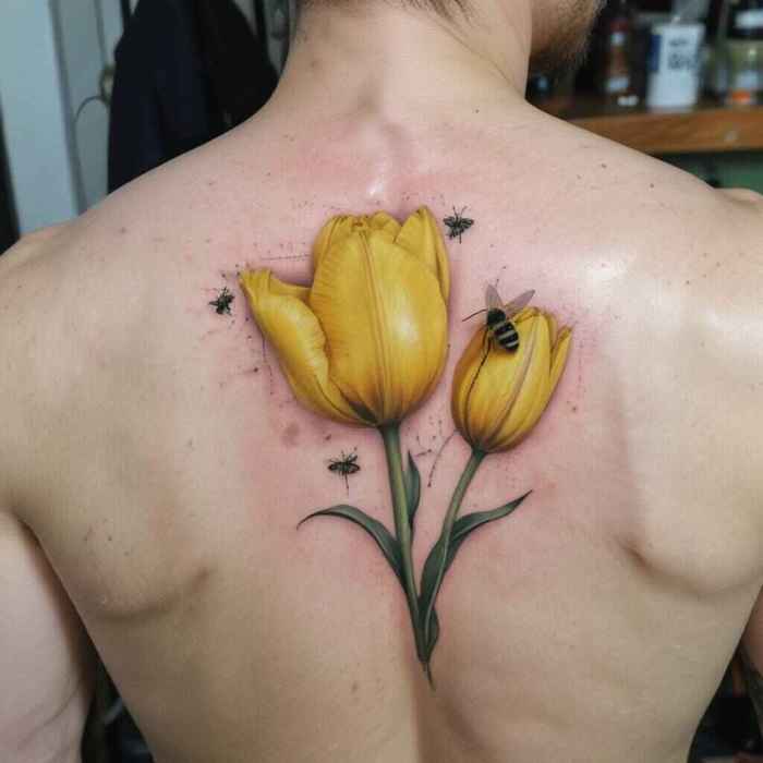 Yellow Tulip Paired with a Bee tattoo