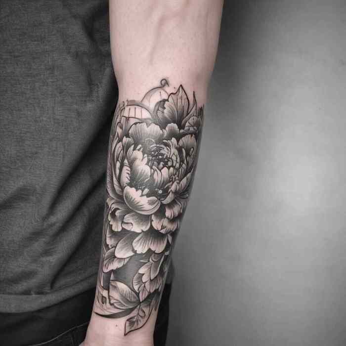 Blackwork Peony Sleeve with Negative Space Detailing tattoo