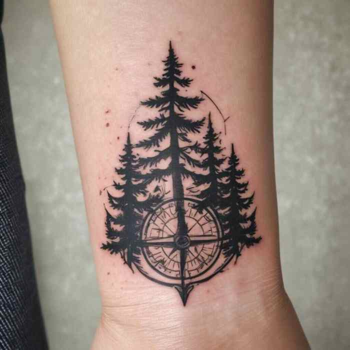 44 Serene Pine Tree Tattoo Ideas To Embrace Nature’s Quiet Strength! 39 Pine Tree with a Compass Design tattoo