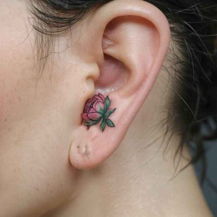 Tiny Peony Bud Behind the Ear Tattoo