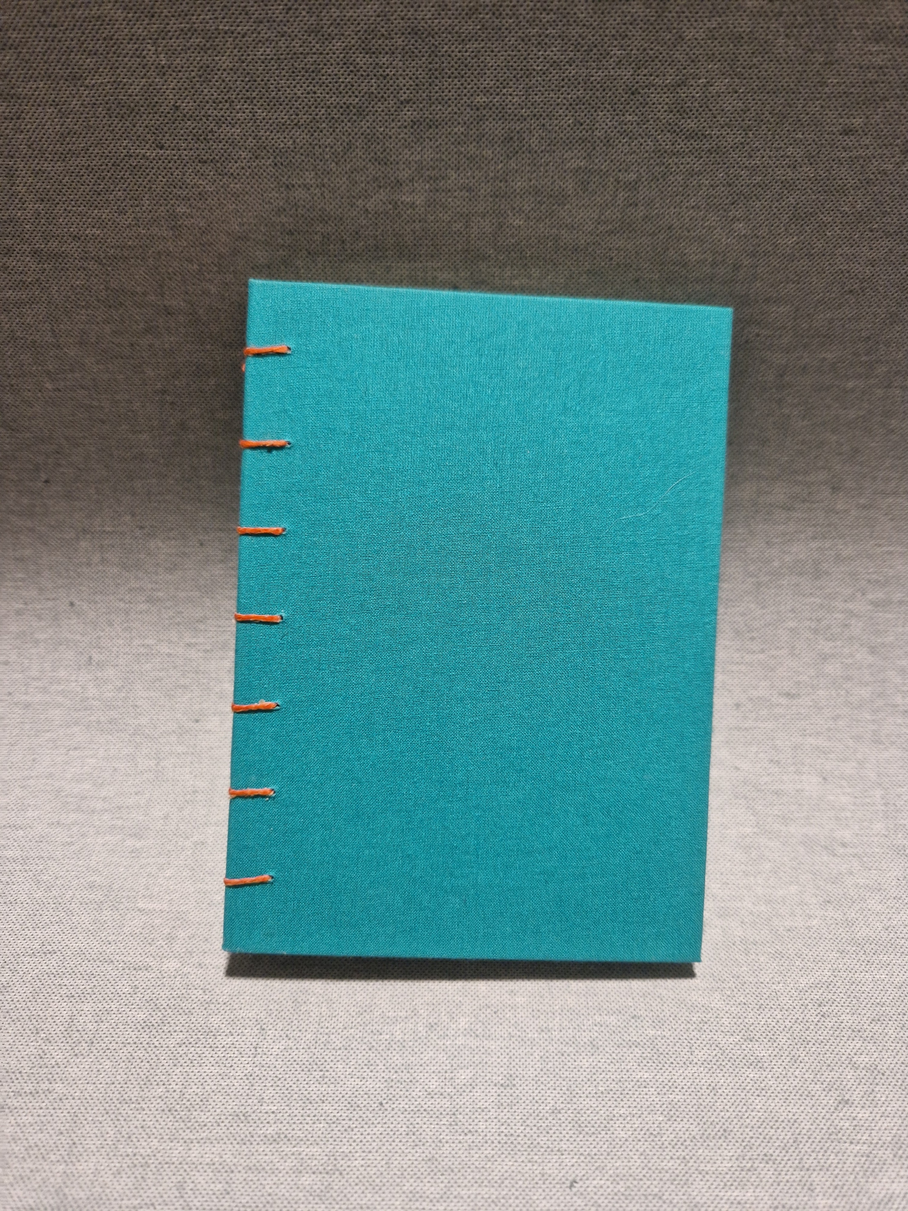 Teal book with orange cotton (A6)