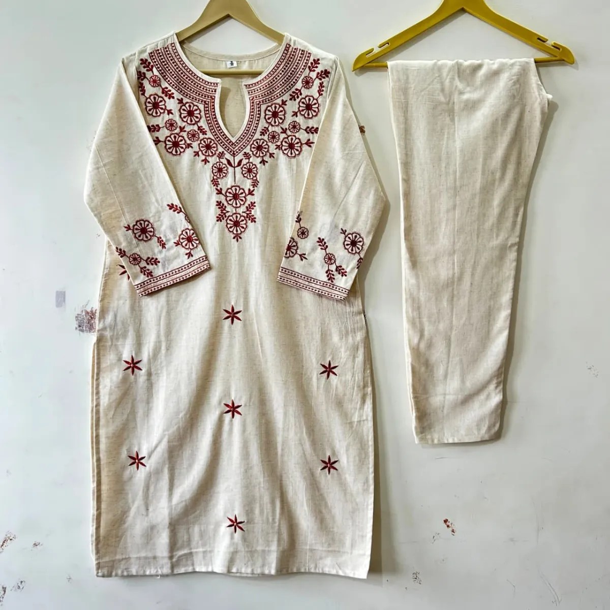 Trouser cut, pocket design, and dupatta drape of Elegant Embroidered Cotton Kurti Set