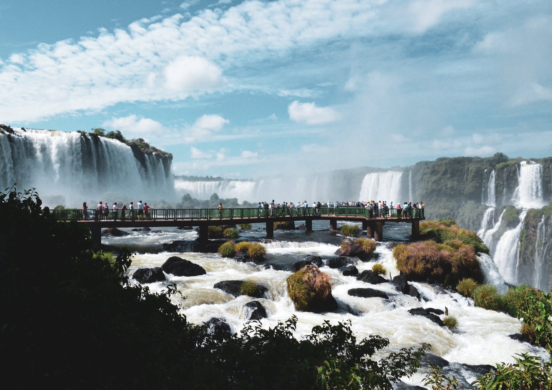 water falls under blue sky