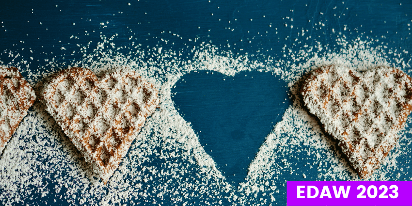 2 Heart Shaped Cookies with One Absent leaving a heart shaped cutout outlined with sugar.