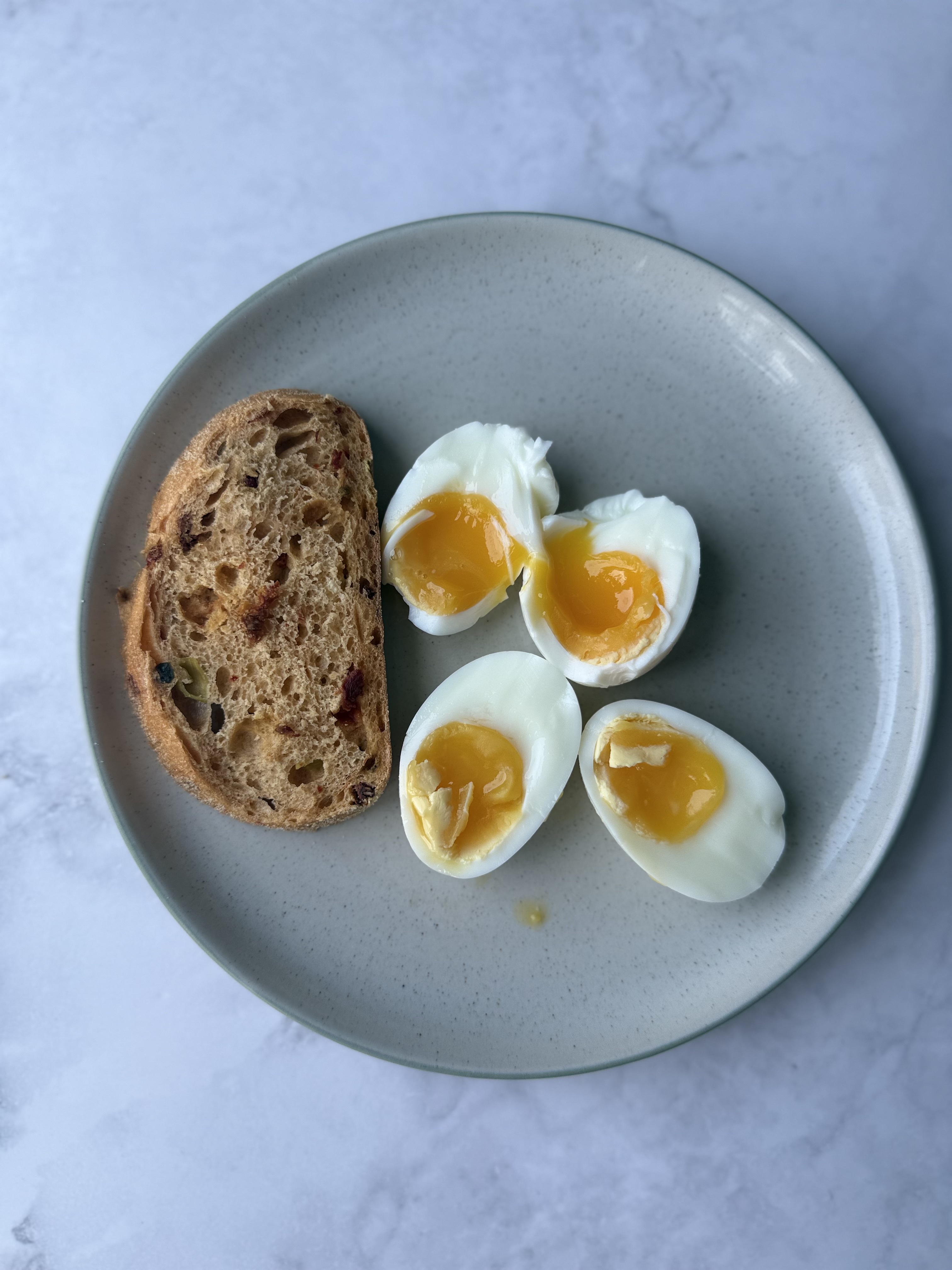 soft boiled gooey eggs with a side of sourdough bread