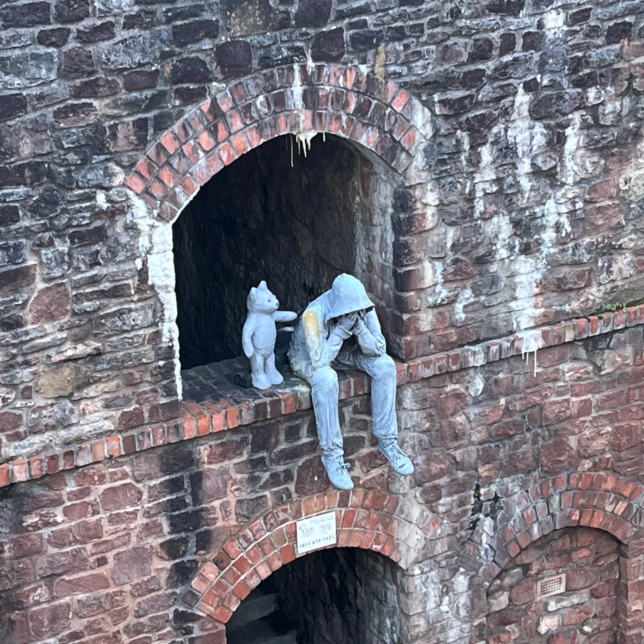 Man and his bear sculpture