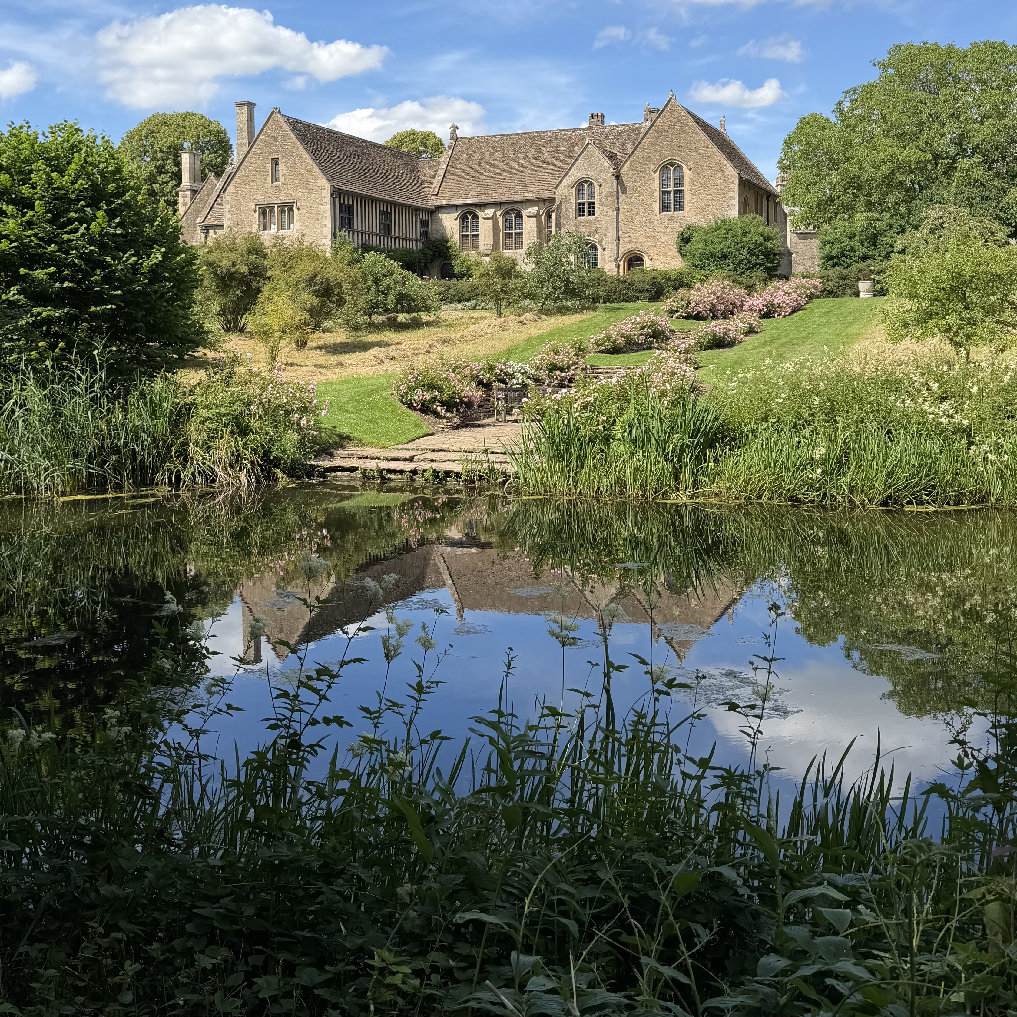 Manor House reflected in a large pond