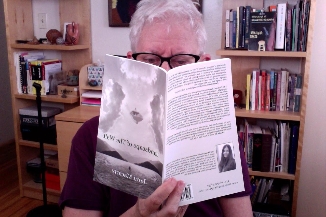 Penelope Starr reads my book in Tucson, Arizona while her looms over her shoulder